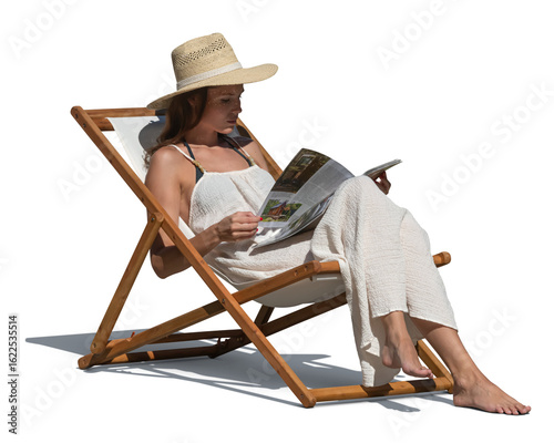 Fotografie Woman in a white summer dress and wearing a hat sitting in a garden chair in the