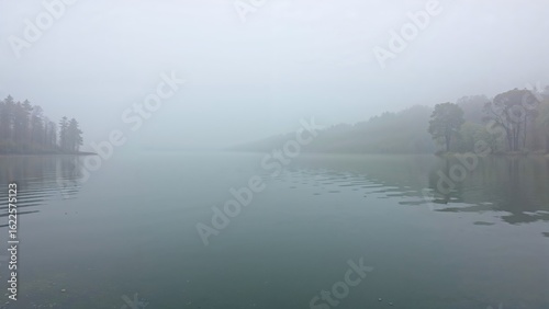 Misty waters of a tranquil lake