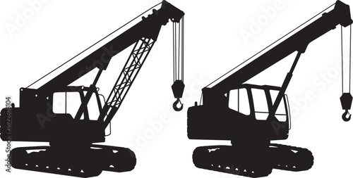 Two construction cranes silhouette