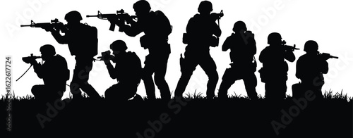 Silhouette of soldiers in combat formation with rifles