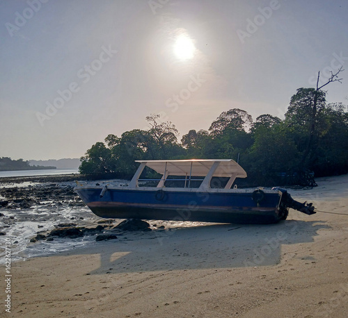 At the time of low tide boat is standing on the bank of the ocean of Swaraj Dweep.