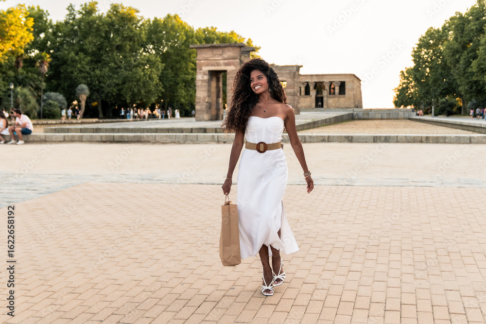 Fototapeta premium Tourist walking near temple of debod in madrid after shopping