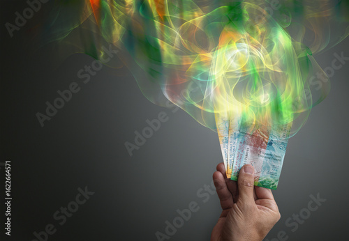 Bild auf Leinwand Money evaporates into colorful vapor or smoke showing inflation or loss of money