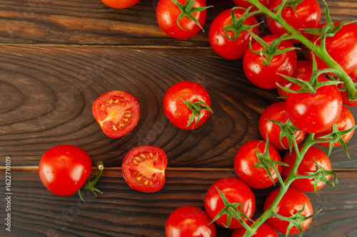 ripe tomatoes on a wooden surface