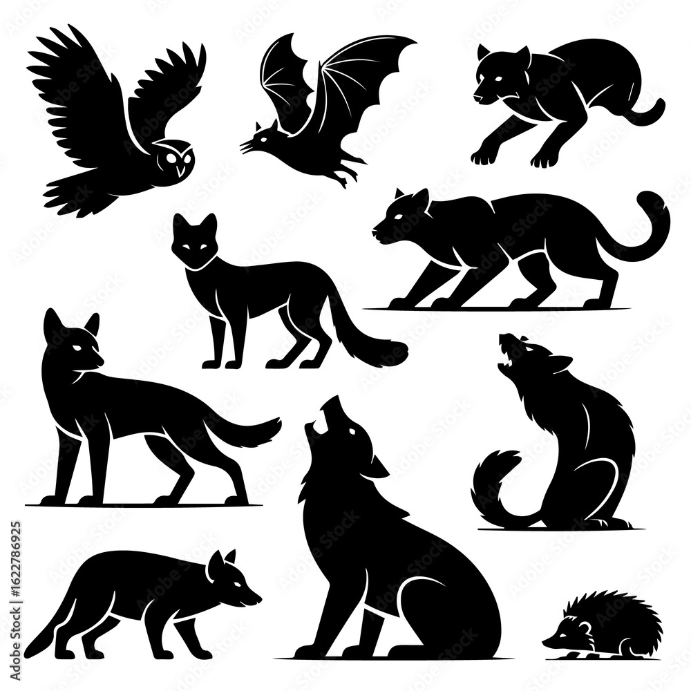 Fototapeta premium Collection of stylized black silhouettes of nocturnal animals including owls bats wolves foxes and a hedgehog on a white background