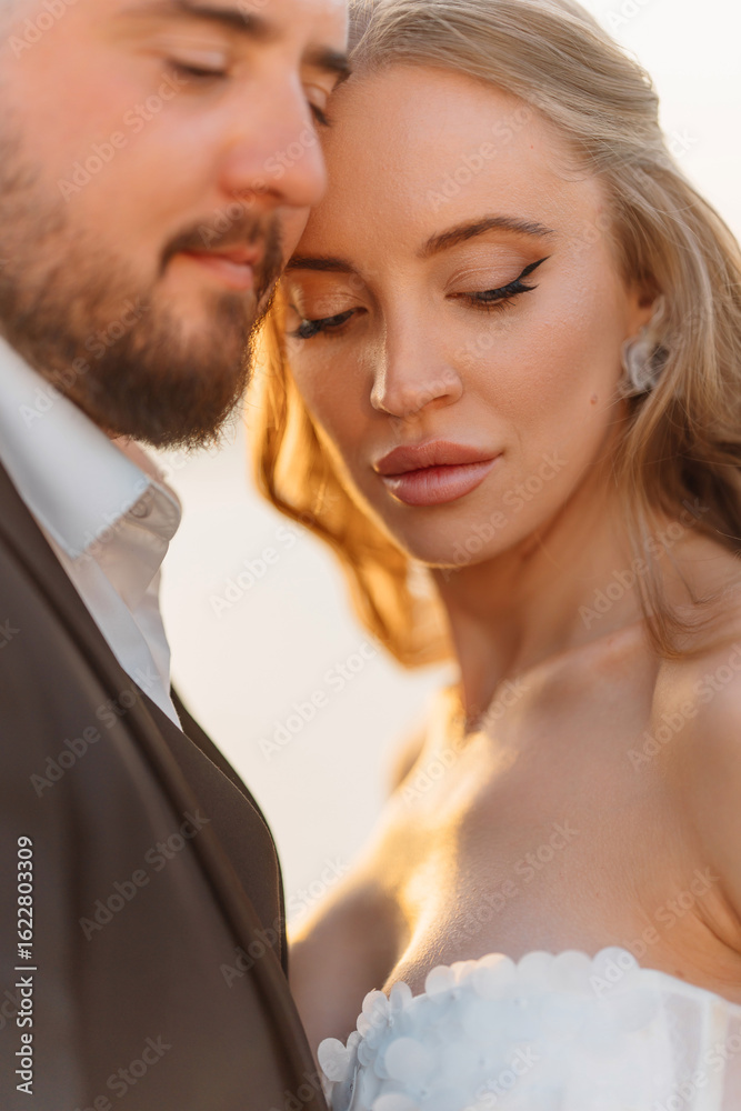 close-up. Gentle and happy bride and groom at sunset. Romantic. close-up. Gentle and happy bride and groom at sunset. Romantic.