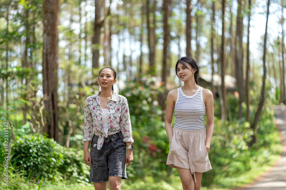 Asian Indonesian Women Walking on Forest Road in Yogyakarta
