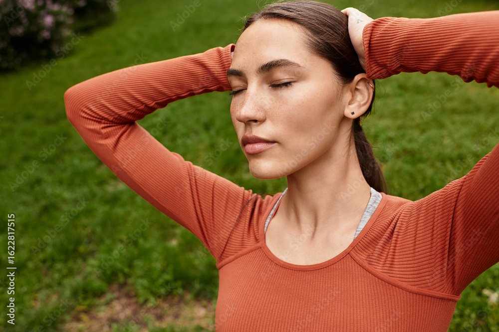 Yoga practice and mindfulness in a serene outdoor setting with a young woman Yoga practice and mindfulness in a serene outdoor setting with a young woman