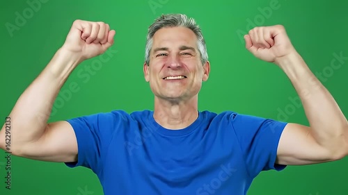 Happy man flexing arms in victory gesture