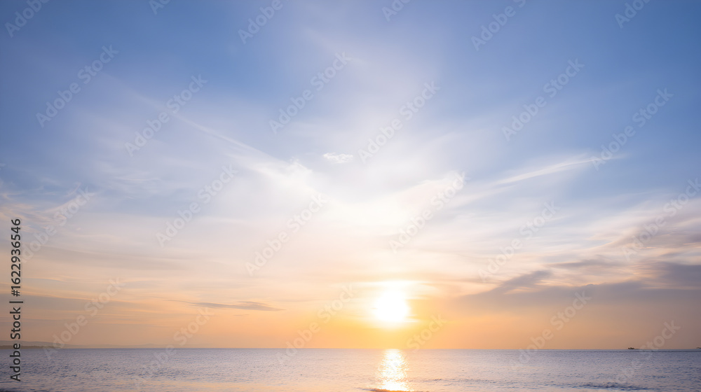 Fototapeta premium Golden hour coastal skyline with tranquil water and expansive sky perfectly suited to travel marketing posters and social media
