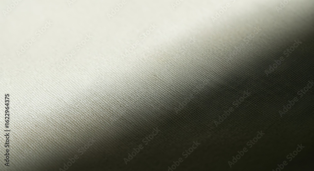 Obraz premium Cream fabric texture with a soft diagonal light and shadow