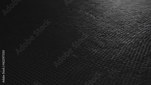 Textured black surface with subtle patterns, ideal for backgrounds or abstract designs