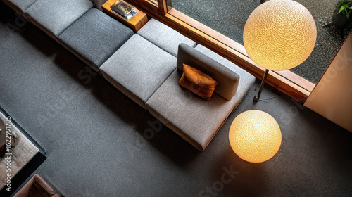 Contemporary living space with streamlined furniture and a neutral color palette under soft lighting.