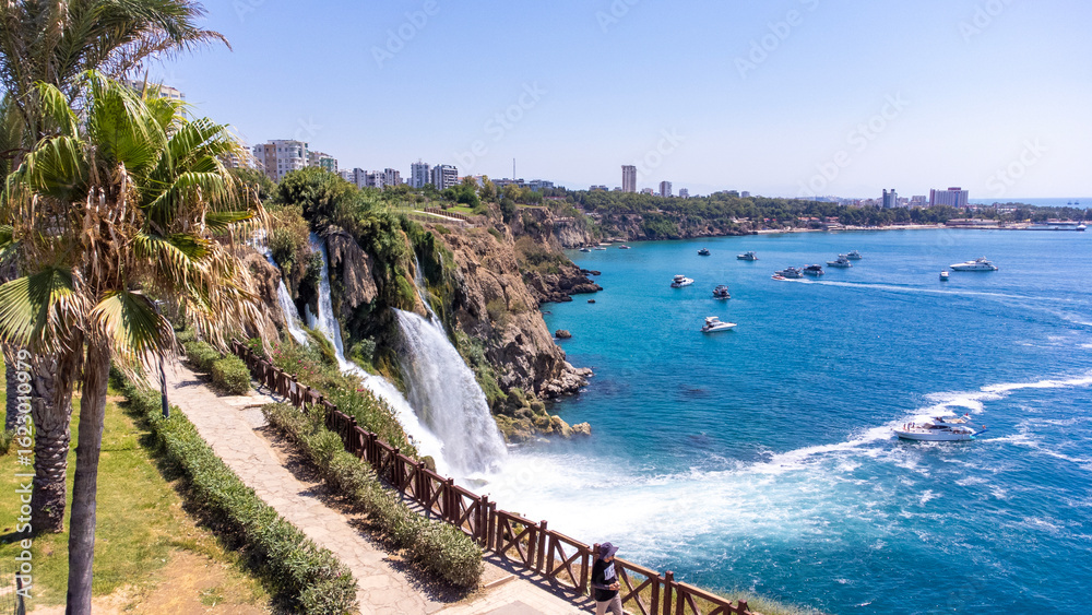 Naklejka premium Waterfall Duden (Karpuzkaldiran selalesi) falling into the Mediterranean sea. Waterfall falling into sea. Waterfall stream. Aerial drone shooting. Antalya - Turkey