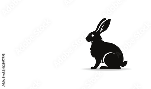 Simple Silhouette of a Sitting Rabbit Showing Its Profile View on a White Background