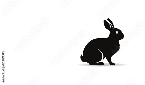 A Stylized Black Silhouette of a Rabbit Sitting in Profile on a White Background with a Subtle Shadow