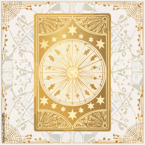 An ornate golden tarot card back featuring a celestial wheel with stars and bats on a decorative background.