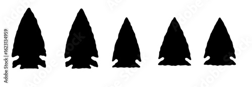 A set of five black tribal arrowhead illustrations isolated on white background