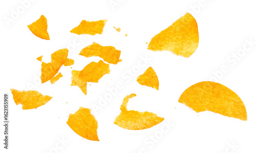 Fotografie Potato chips crumbs with red paprika  isolated on white background and texture