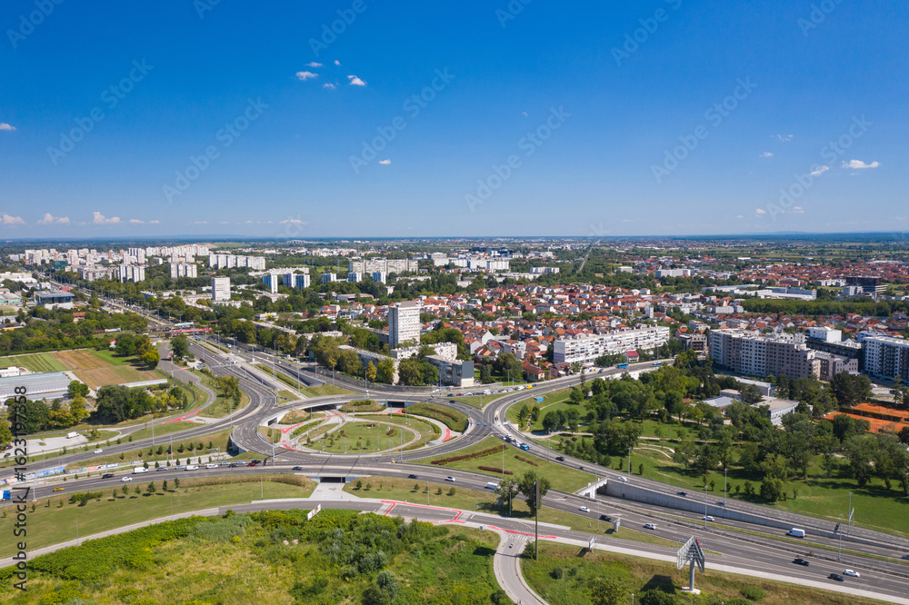 Fototapeta premium Zagreb, Croatia, aerial view of new roundabout in Remetinec neighborhood, city traffic road with vehicles driving