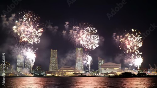 Fireworks over a city skyline at night