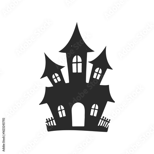 Spooky silhouette of a haunted house with steep roofs and arched windows