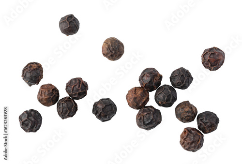 Black peppercorns falling on transparent background
