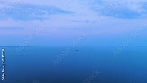 Aerial view of an oil tanker at sea during blue hour at sunset