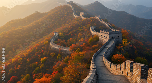 Photograph a winding section of the Great Wall of China in Beijing or Hebei province during autumn, surrounded by orange and red foliage. Emphasize the ancient stonework, mountain ridges, and serpenti