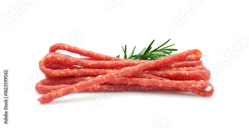 Dried cured sausages, thin salami sticks, cabanossi or kabanosy isolated on white background	