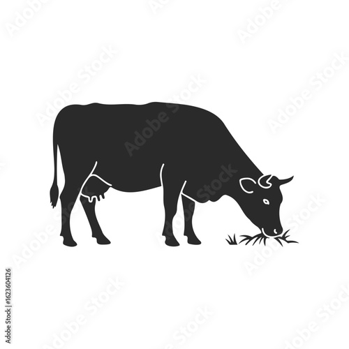 Silhouette of a cow grazing on grass vector art