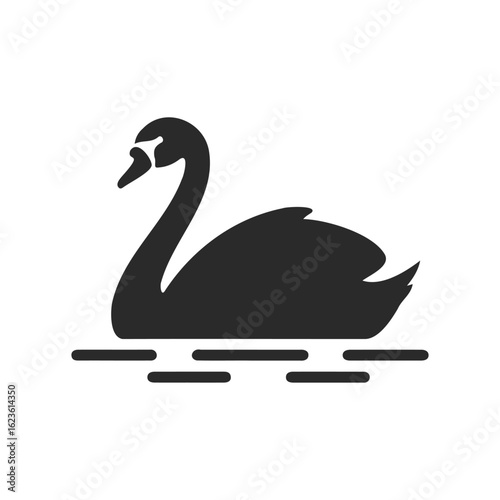 Silhouette of a graceful swan gliding on calm water