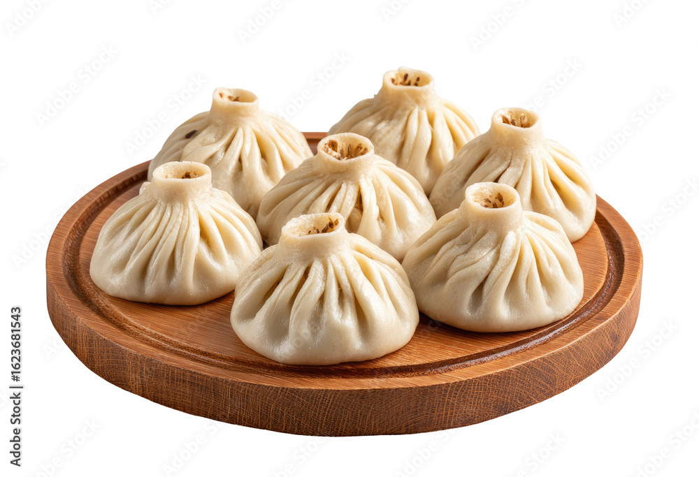 Obraz premium Six dumplings, light beige color, on a round wooden platter