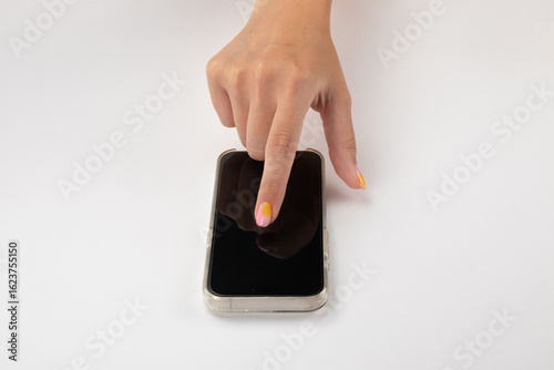 Caucasian woman's hand touching a smartphone screen (mockup), isolated on white background