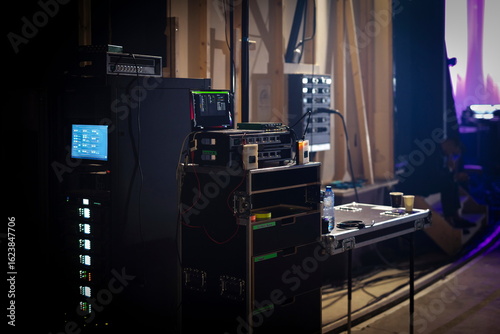 Foto Professional broadcast control equipment with multiple monitors screens and audi