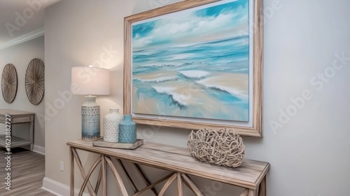 Coastal-style entryway console table with artwork and decorative accents