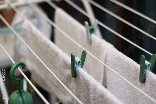Schilderij op canvas Towels Hanging on a Drying Rack with Clothespins Ikea