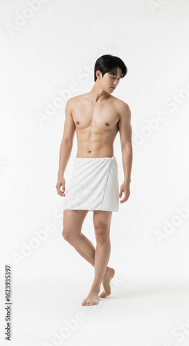 	
A fit Asian man in a white towel, showcasing a healthy body and skincare. Perfect for health, wellness, and beauty themes.	

