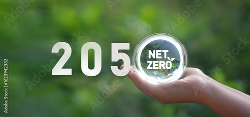 Quadro su tela Net-zero and carbon-neutral greenhouse gas emissions concept, carbon dioxide emissions and 2050 green goals on a crystal globe