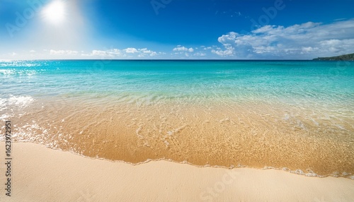 a golden beach with crystal clear waters and soft white sand under a bright sunny sky