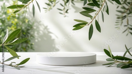 Minimalist podium with olive branches isolated on white background for product presentation