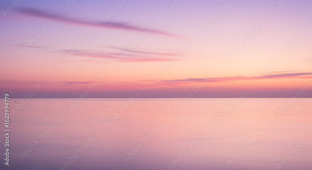 Obraz premium Dreamy pastel seascape with a tranquil horizon captures the gentle hues of dawn