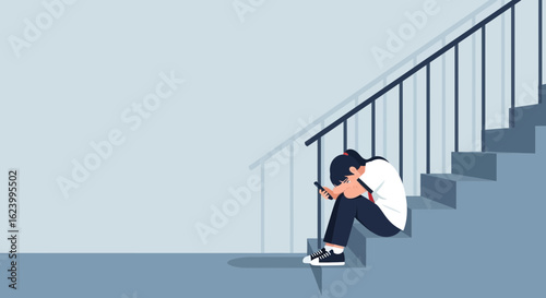 Student Sits On Stairs Depressed After Receiving a Message