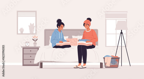 Two Young Women Organizing Clothes Together At Home On The Bed