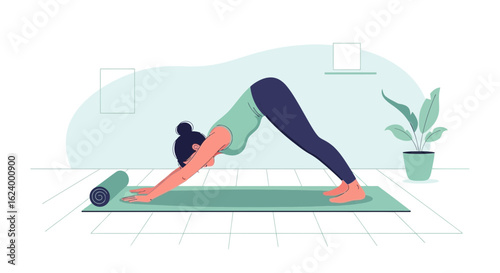 Woman Practicing Yoga Downward Facing Dog Pose on Mat at Home Studio