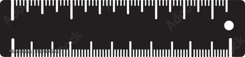 Black ruler with white markings and a circular end detail measuring measurement