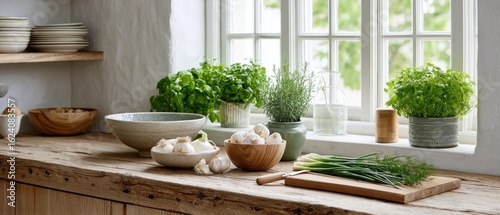 Wallpaper Mural Bright kitchen counter filled with fresh herbs, vegetables, and bowls near a window on a sunny day Torontodigital.ca