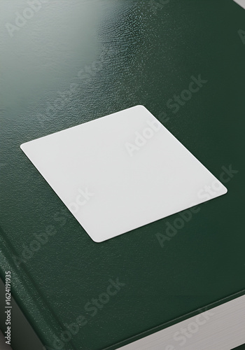 Blank square sticker on dark green book cover