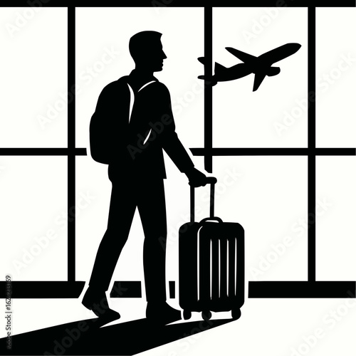 Silhouette of a businessman with a suitcase, standing and waiting for his flight at the airport
