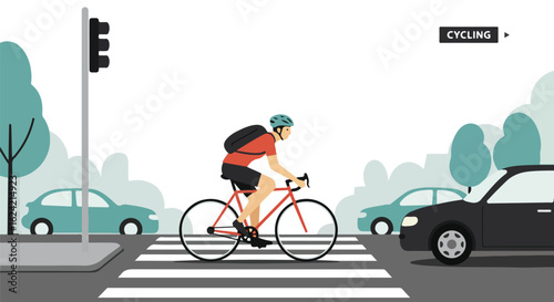 Cyclist crossing on zebra stripes, cars wait at traffic lights in town